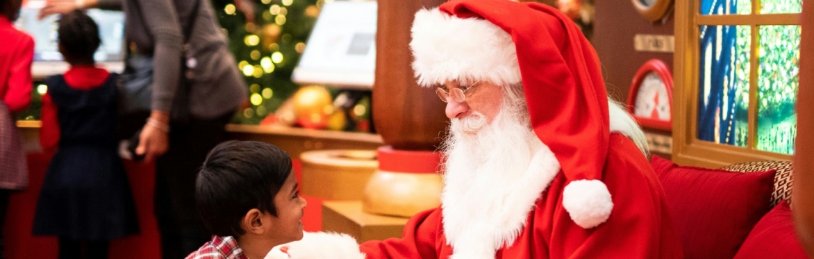 Santa giving a present to a child