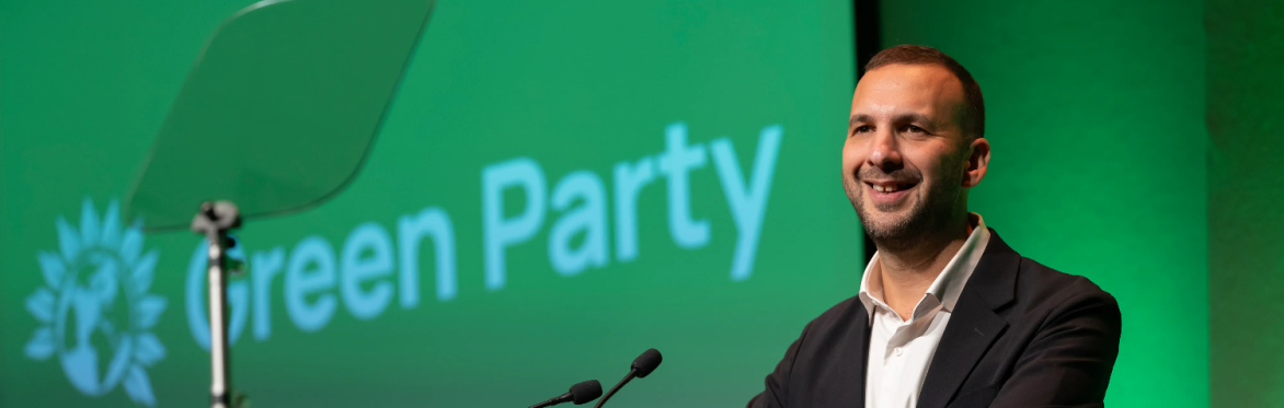 Zack Polanski standing on the stage at Green Party Conference 2025