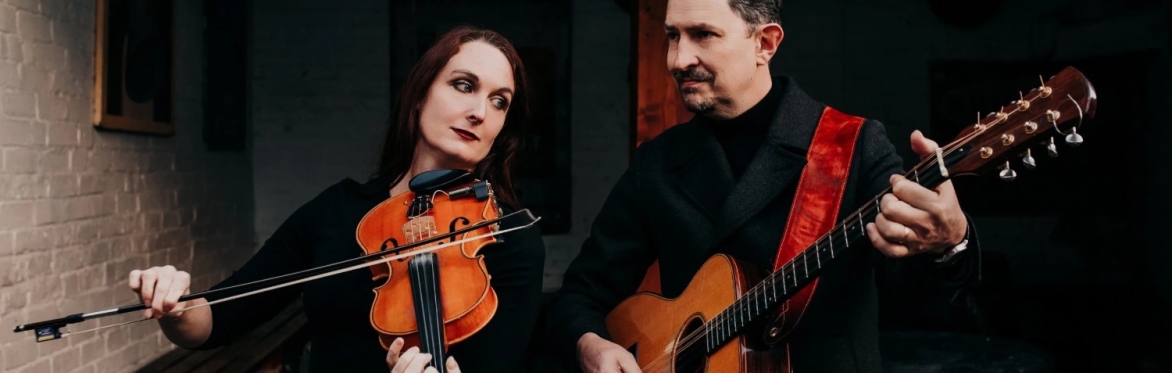 Nancy Kerr and James Fagan, playing fiddle and guitar and looking sultry and smooth