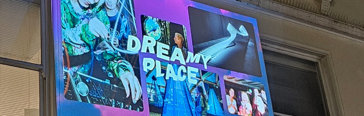 A projection of Dreamy Place promotion onto a wall.