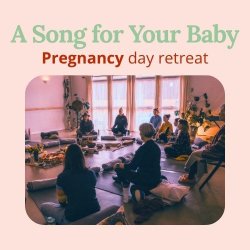 A seated circle of pregnant women in a softly lit room