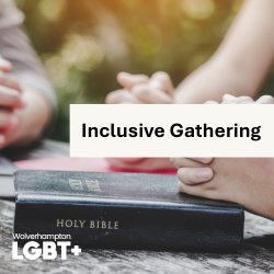 a close up shot of a group gathered around a table with a bible in the centre.