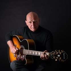 Richard Townend from The Mighty Bosscats featured with a guitar