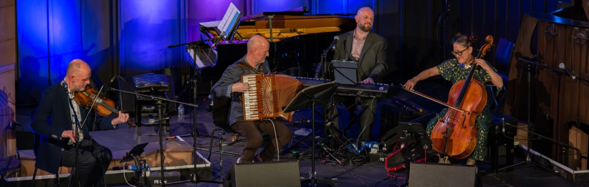 from left to right, Duncan Chisholm, Donald Shaw, Hamish Napier and Su-a Lee on stage playing their instruments