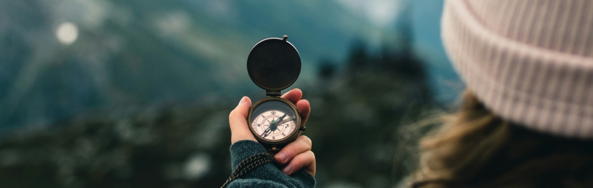 Photo by <a href="https://unsplash.com/@lureofadventure?utm_source=unsplash&utm_medium=referral&utm_content=creditCopyText">Ali Kazal</a> on <a href="https://unsplash.com/photos/person-holding-compass