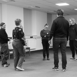 Students standing in a circle at an Improv Comedy Workshop