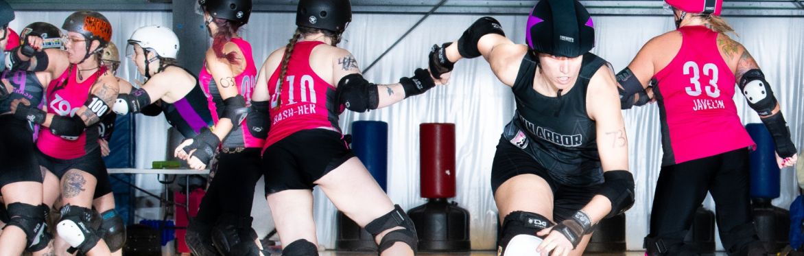 A2 Roller Derby player skating away from players on the other team.