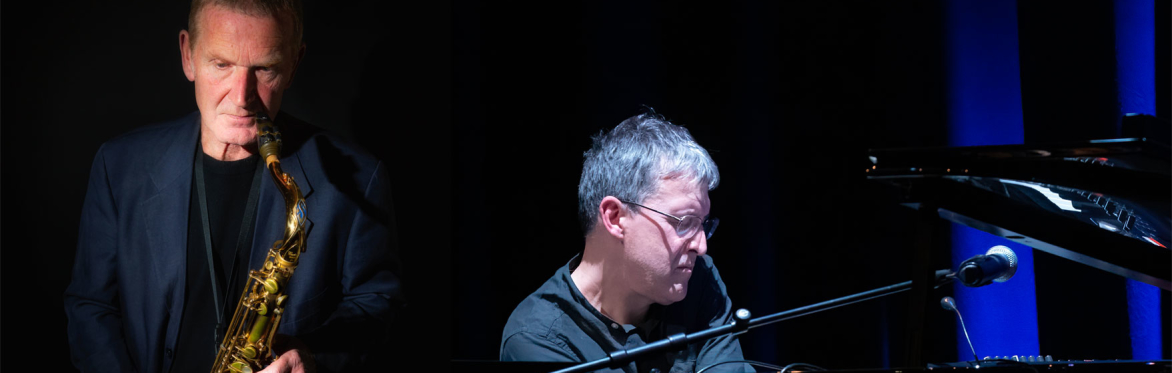 Split image of two jazz musicians performing. A saxophonist stands holding his instrument while a pianist plays a grand piano, both lit by spotlights against a dark stage.