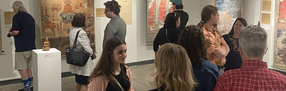 A group of visitors in the East to West exhibit