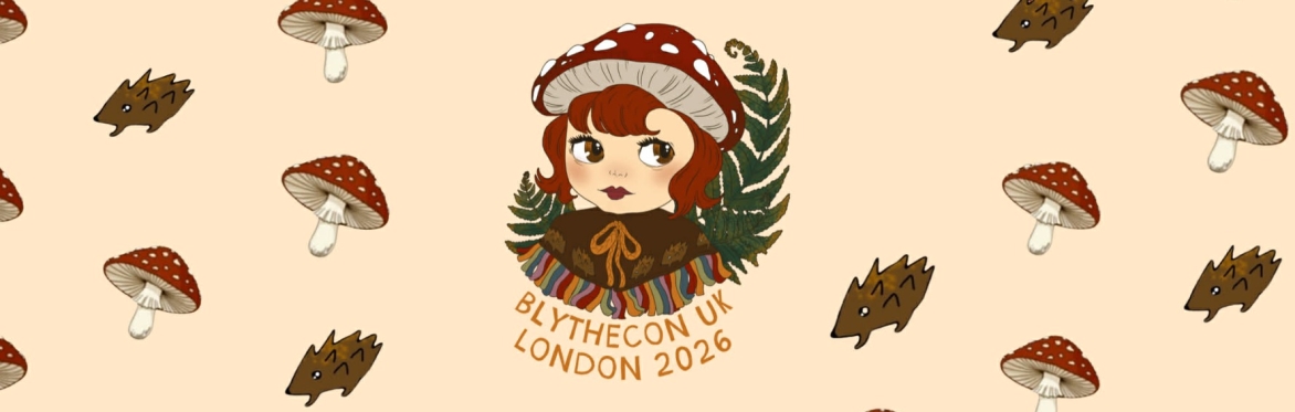 A cream background with a central bust of Blythe doll with short, dark red hair, red toadstool hat, & brown cape shawl with a hedgehog motif & green ferns behind. BlytheCon UK London 2026.
