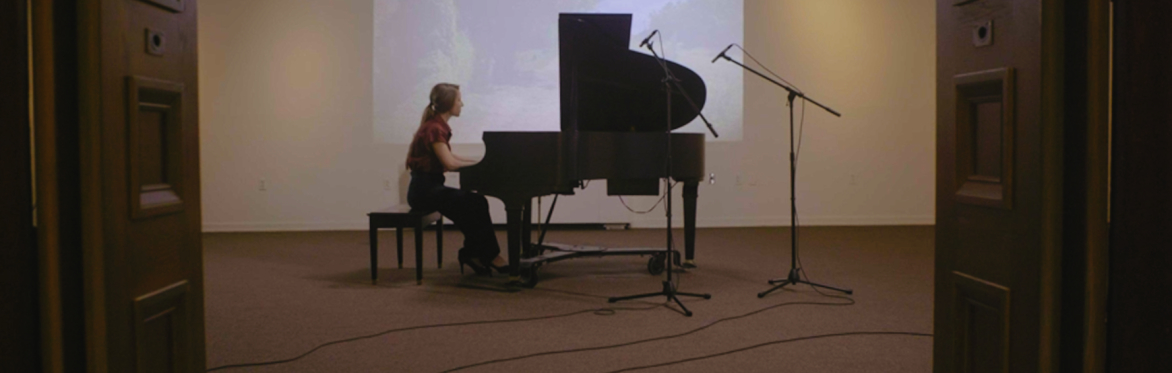 Becky Reesor performing Stop the Clock on grand piano live in studio at Saint John Arts Centre