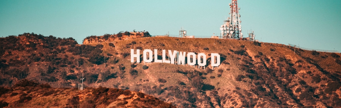 The Hollywood sign, made up of white letters on a hillscape.