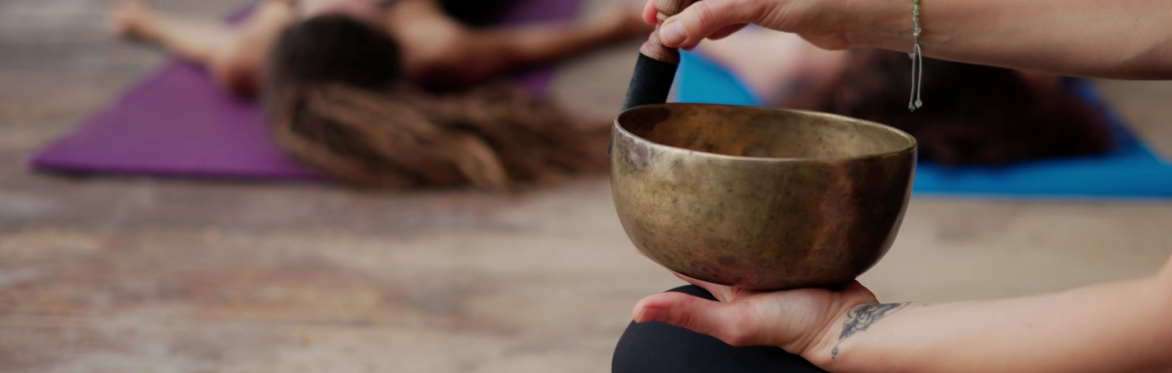 A yoga class with sound bowls resonating