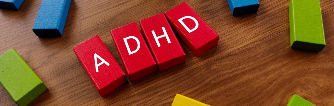 ADHD spelled out in red building blocks