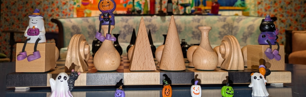 Halloween figurines near a chess set