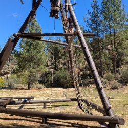 Base of the Ropes Course with a Person about halfway up.