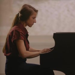Becky Reesor performing Stop the Clock on grand piano live in studio