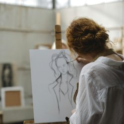 Girl drawing at an easel