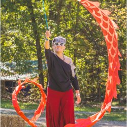 Autumn Fires attendee with a flow toy