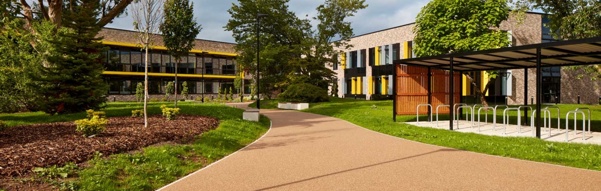 four students walking by STEAM academy