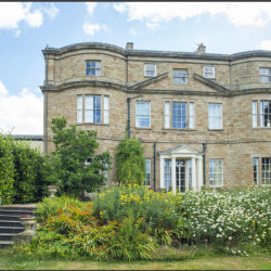 Photo of Thundercliffe Grange, a 3 storey 18th century house.