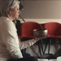 Person holding Tibetan Singing Bowl