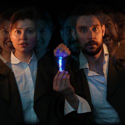 Two figures with a candle in between showing their light and dark sides