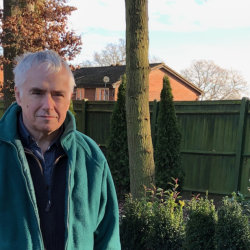 Tim Maude in a garden