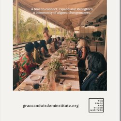 image of women at long table one woman standing and speaking