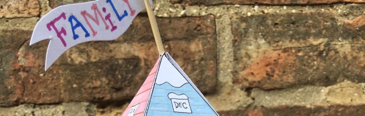 A collage of different architecture, including towers abd domes. Photographs have been cut out and stuck onto card, some blue card is visible underneath.