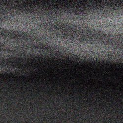 fuzzy, pixelated grey clouds and dark patches