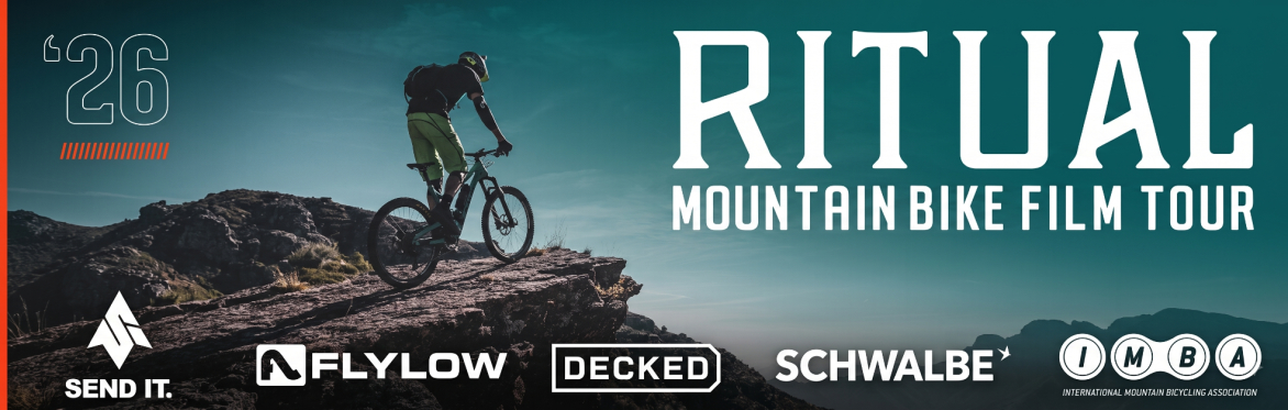 person riding mountain bike on top of a mountain