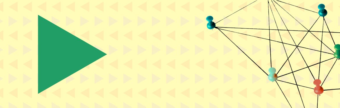 Green triangle on a colourful patterned background