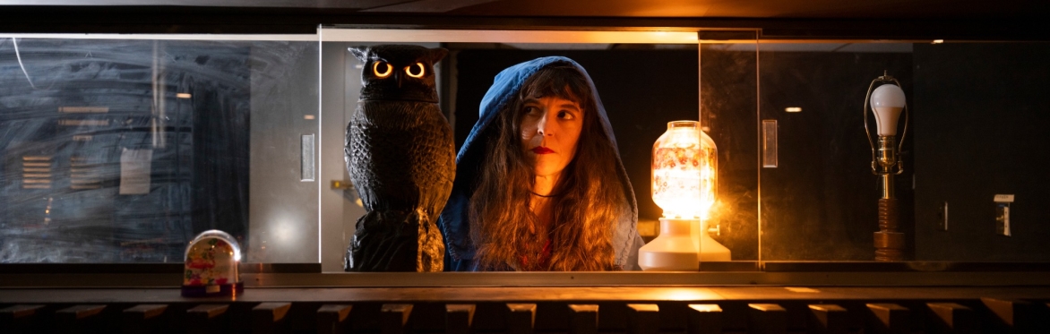 Composer Natacha Diels with an owl with glowing eyes