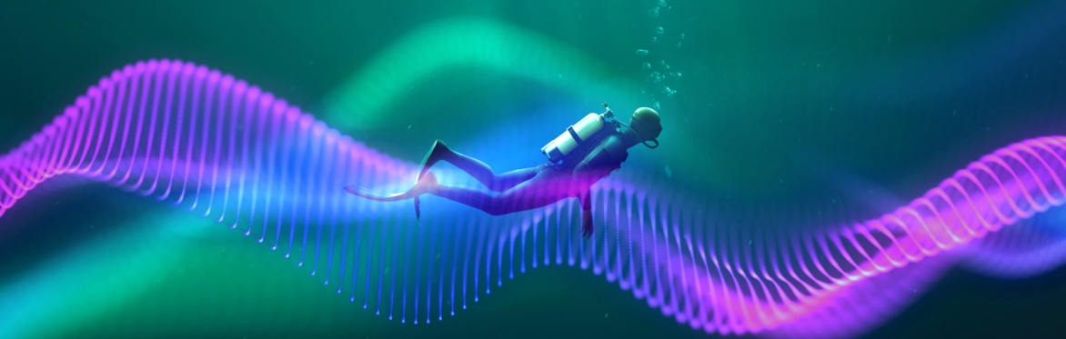Scuba diver on a purple coloured wave