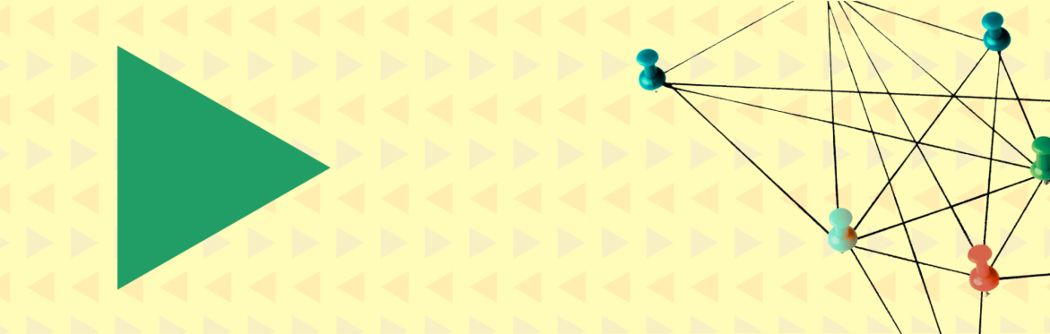 Green triangle on a colourful patterned background
