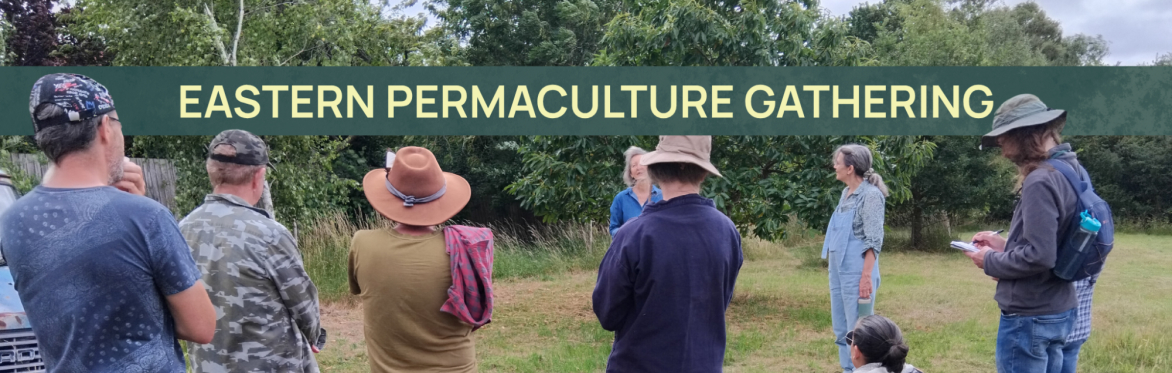 Eastern Permaculture Gathering, sign above people listening to another person speak in a circle