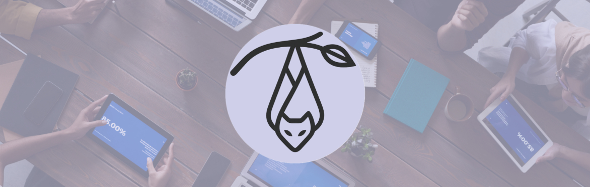 A bat logo overlayed on an image of people on laptops and tablets at a table