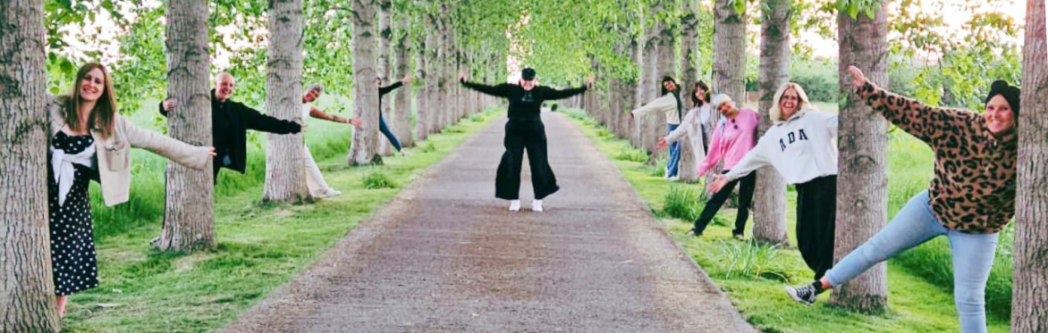 Women with alopecia hiding behind trees