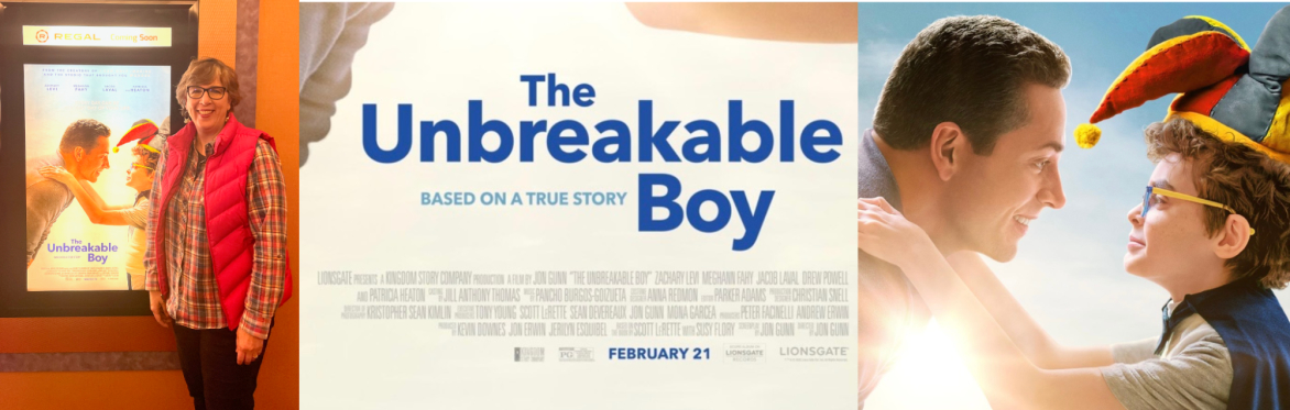 A movie poster for The Unbreakable Boy with a father looking at his son.