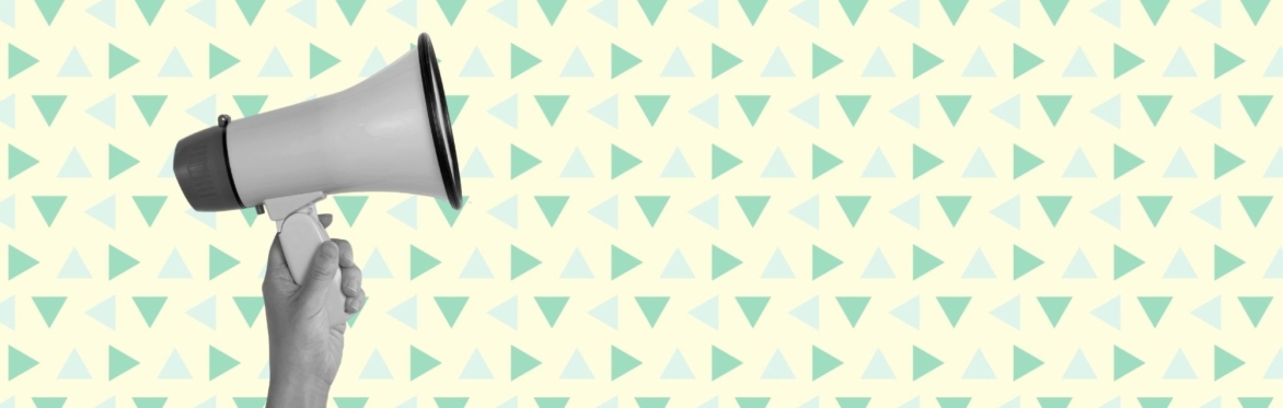 A black and white hand holding a speakerphone over a yellow background with green triangles.