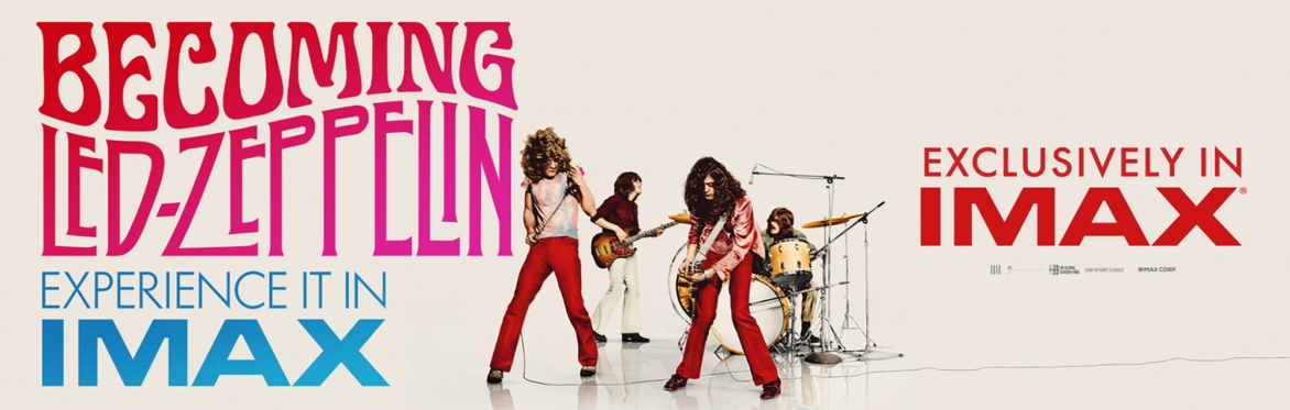 The band Led Zepplin playing guitars and drums