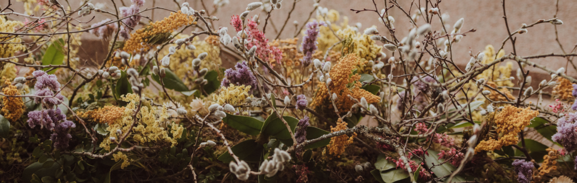 Wildflowers and twigs gathered together.