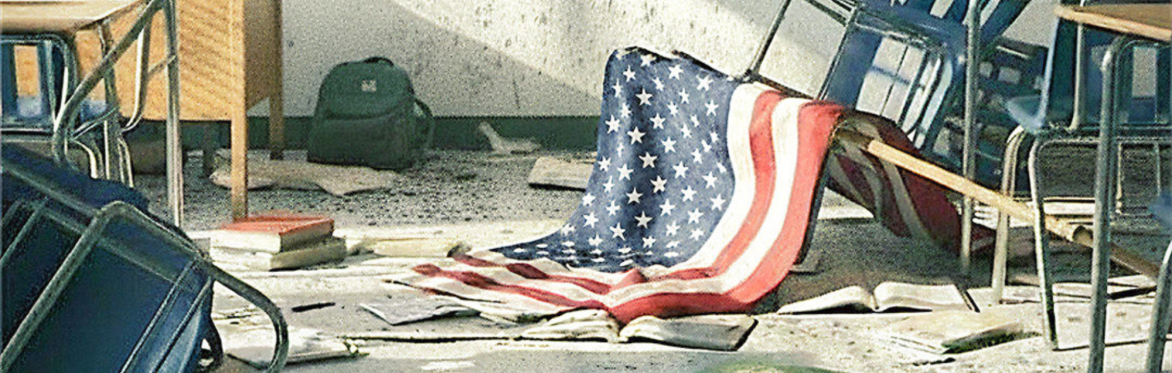 An overturned classroom — broken desks and chairs, scattered books and a backpack, with a tattered American flag draped across the wreckage.