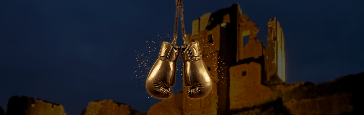 Corfe Castle with golden boxing gloves