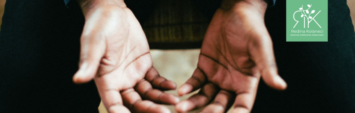 Opened hands in prayer and surrender to God