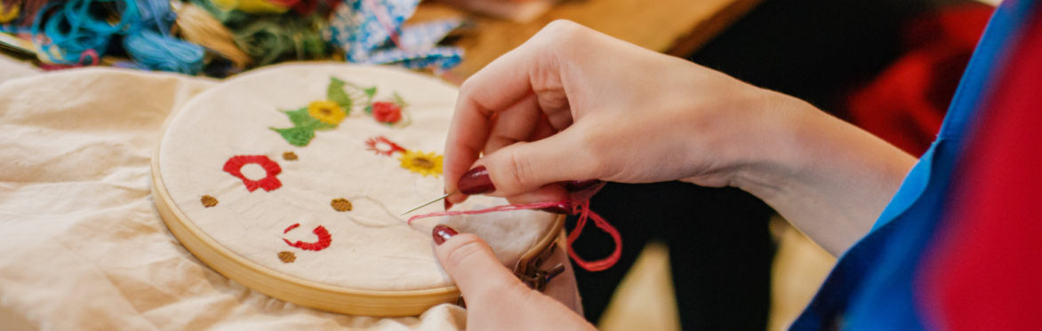 guest making embroidery art piece