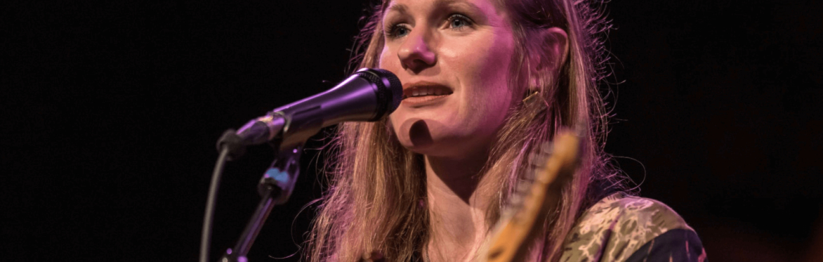 Photo by Dave Parrish of Elizabeth playing slide guitar.