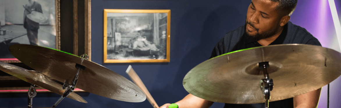 Portrait of Billy Williams playing the drums at Révéler. Photo by Peter McElhinney.