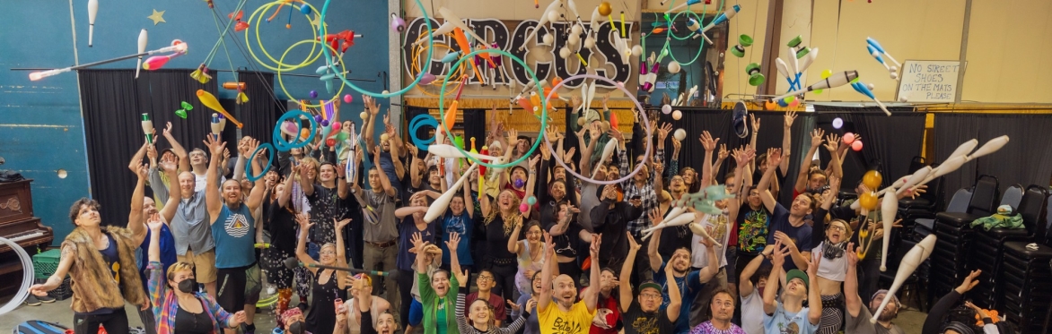 a small army of jugglers joyously hurling all their props in the air at once